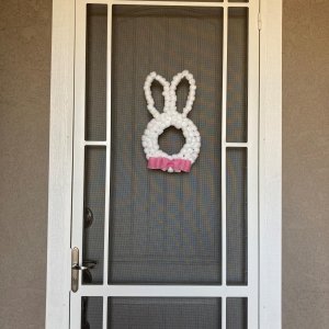How stinkin' cute is this door hanging!  It's a cheap Dollar Tree wire frame and glued on Cotton Balls!