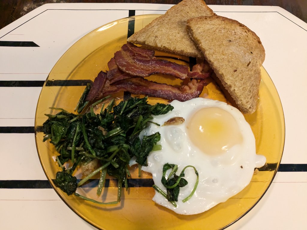 2024-05-10 Duck egg, beet greens, bacon, and whole wheat toast.jpg