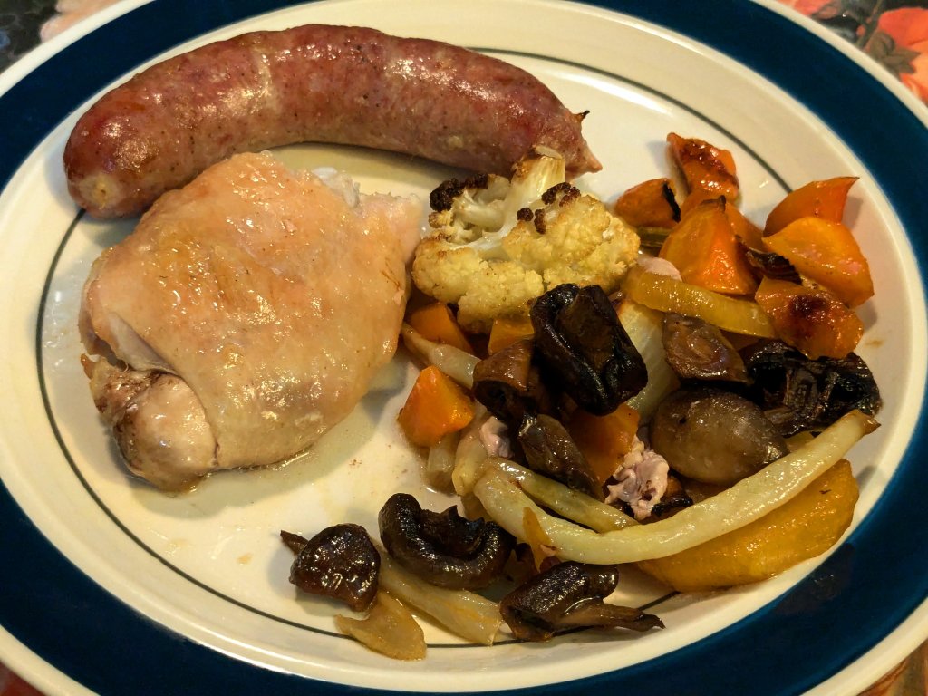 2024-09-23 Tray bake of sausage, chicken leg, mushrooms, and veggies up close.jpg