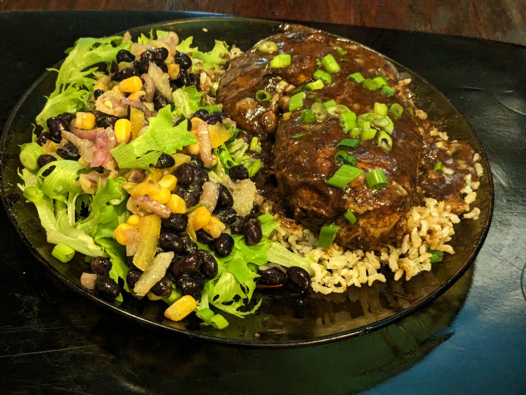 Chicken Lazone on brown basmati rice and Southwest bean salad on a bed of lettuce.jpg