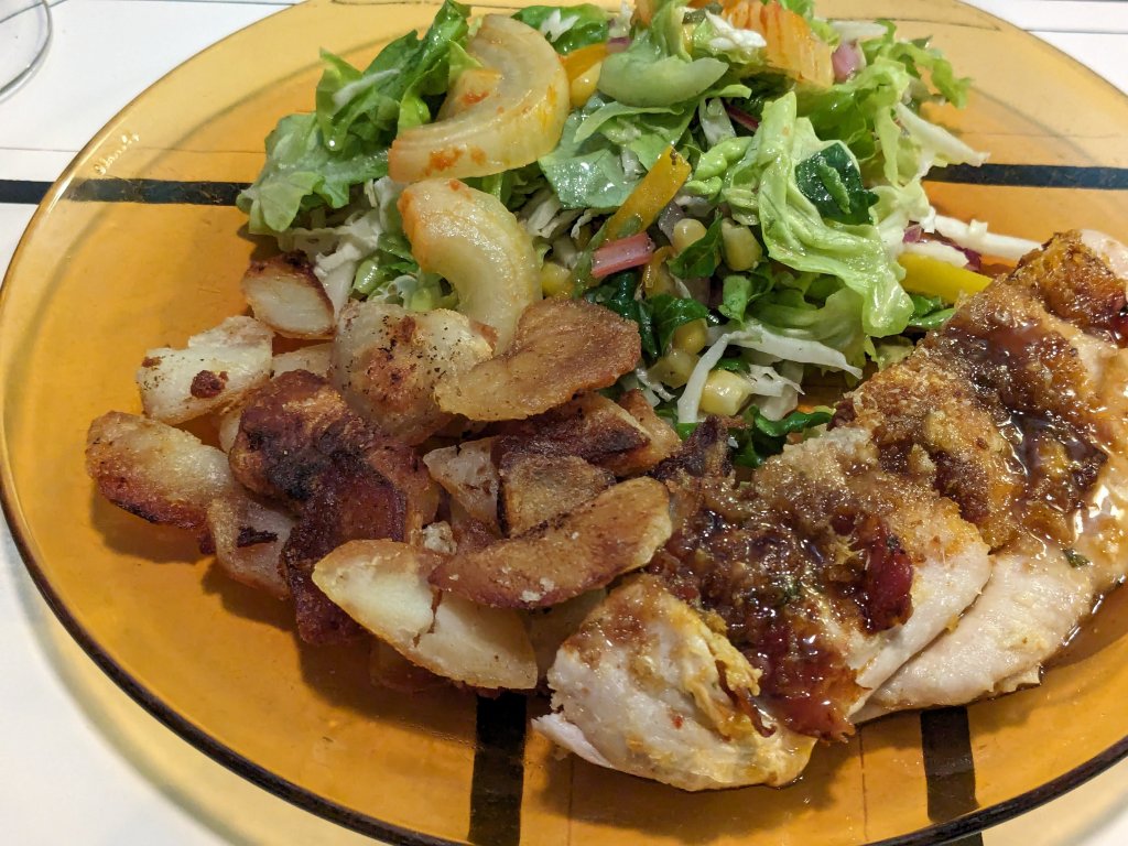 Chorizo stuffed chicken breast, home fries, and salad with homemade vinaigrette.jpg