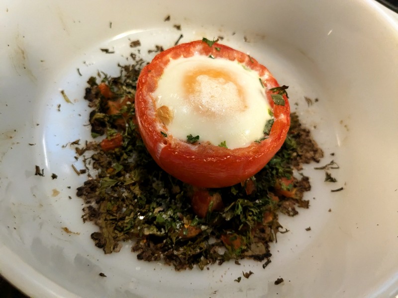 egg baked in tomato on a bed of herbs sm.jpg
