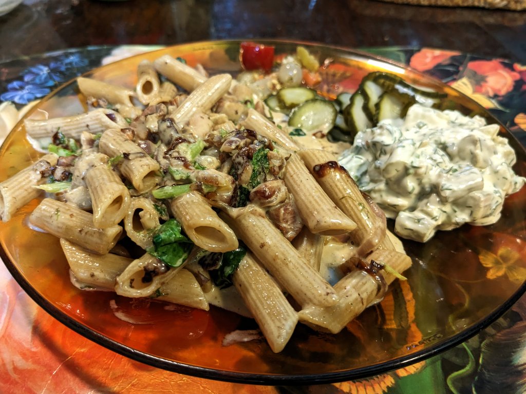 Penne pasta with bacon, cream, and greens and cucumber salad.jpg