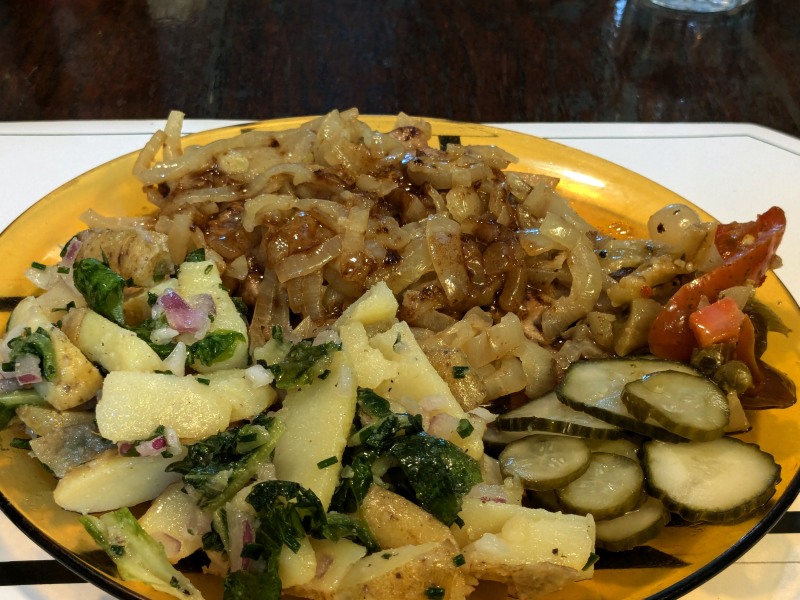 Sautéed pork tenderloin medallions under soft onions, with potato salad and cucumber salad sm.jpg