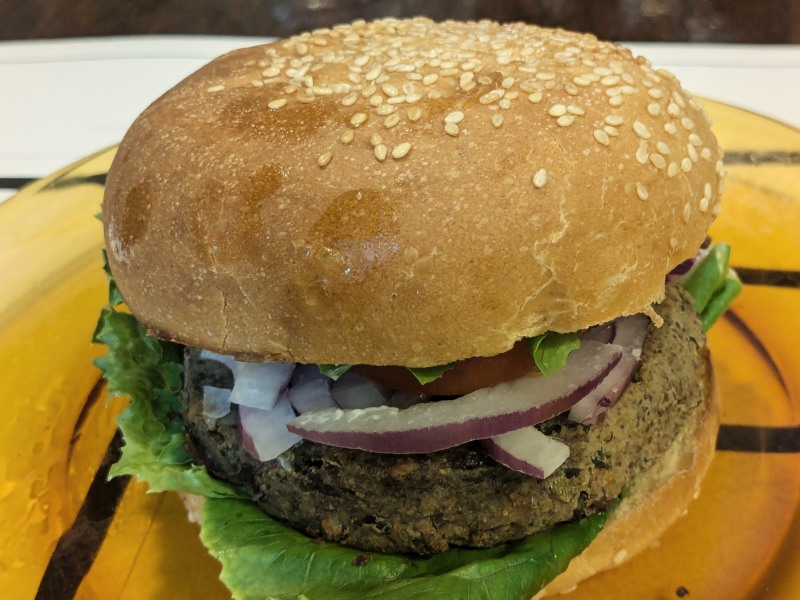 Vegan 3 bean burger on khorasan wheat bun againsm.jpg