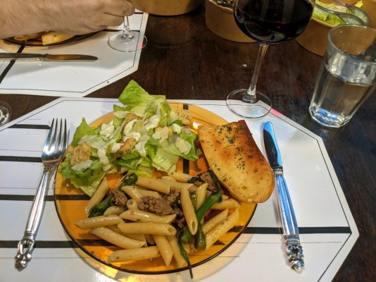 Penne salsiccia, Caesar salad, and garlic bread from Enoteca Moderna Pizzeria Monza.jpg