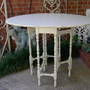 GRANDMA'S GATELEG TABLE USED WITH A RECTANGULAR MARBLE TOP