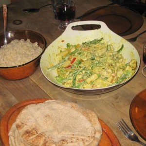 Vegetable curry with chicken, served with brown basmati rice and wholewheat pita.