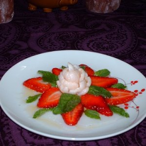 Lychee nut flower with strawberries and mint, drizzled with White Truffle Oil.