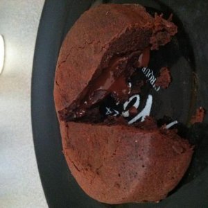 My molten lava cake with hot, warm chocolate flowing out of the middle of a chocolate cake!