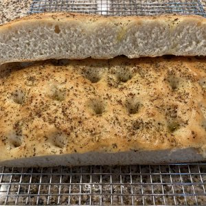 My very first try at making my own Focaccia.
I think I didn't have enough water, the crumb on this is pretty tight, but taste none the less.