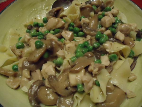 chicken, mushrooms, peas and loads of gravy over wide egg noodles