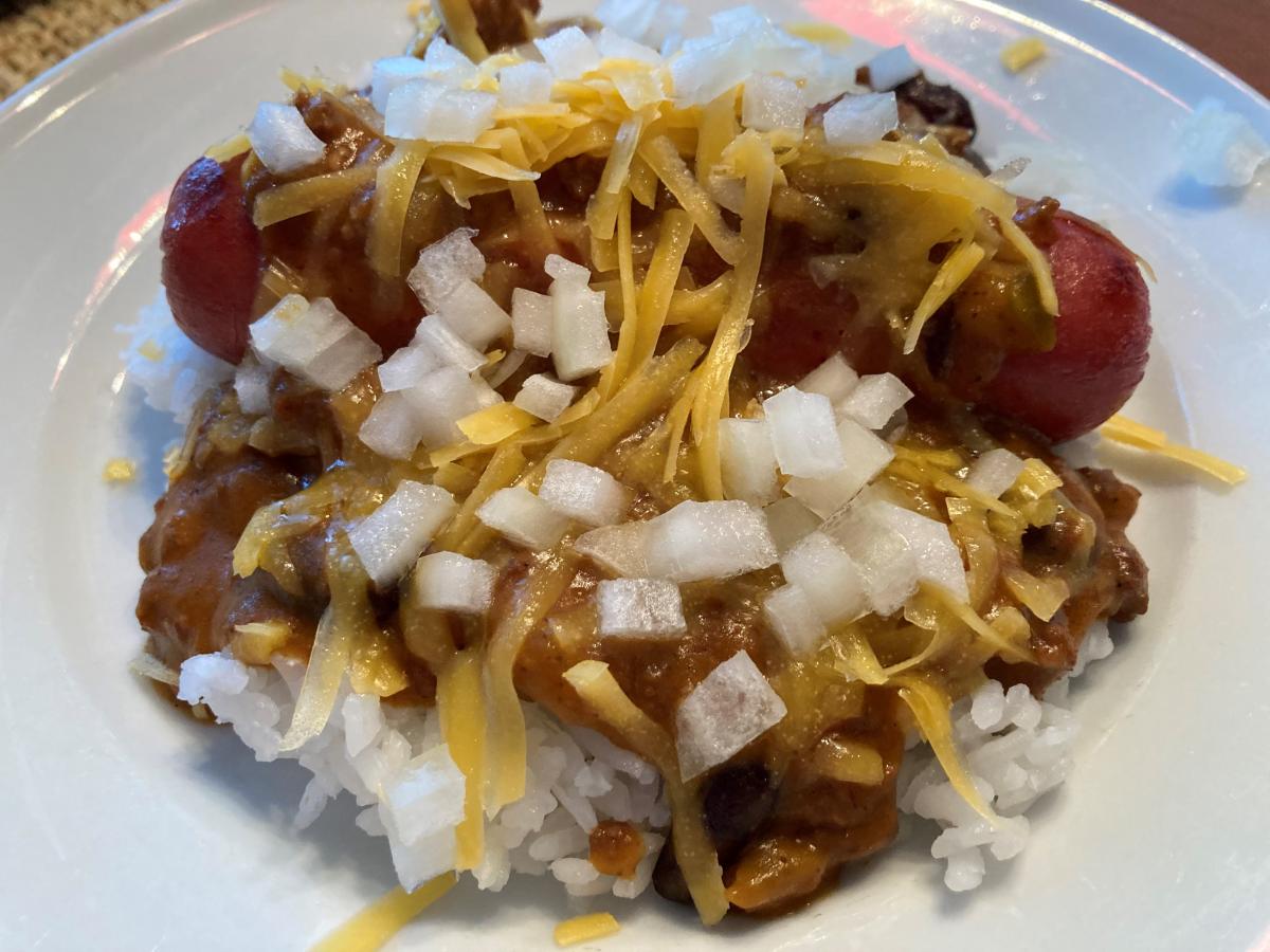 Frozen Zippy's Restaurant (from Honolulu) Chili with a Vienna® Beef Jumbo Frank topped with shredded Tillamook Sharp Cheddar Cheese and diced Sweet Wh
