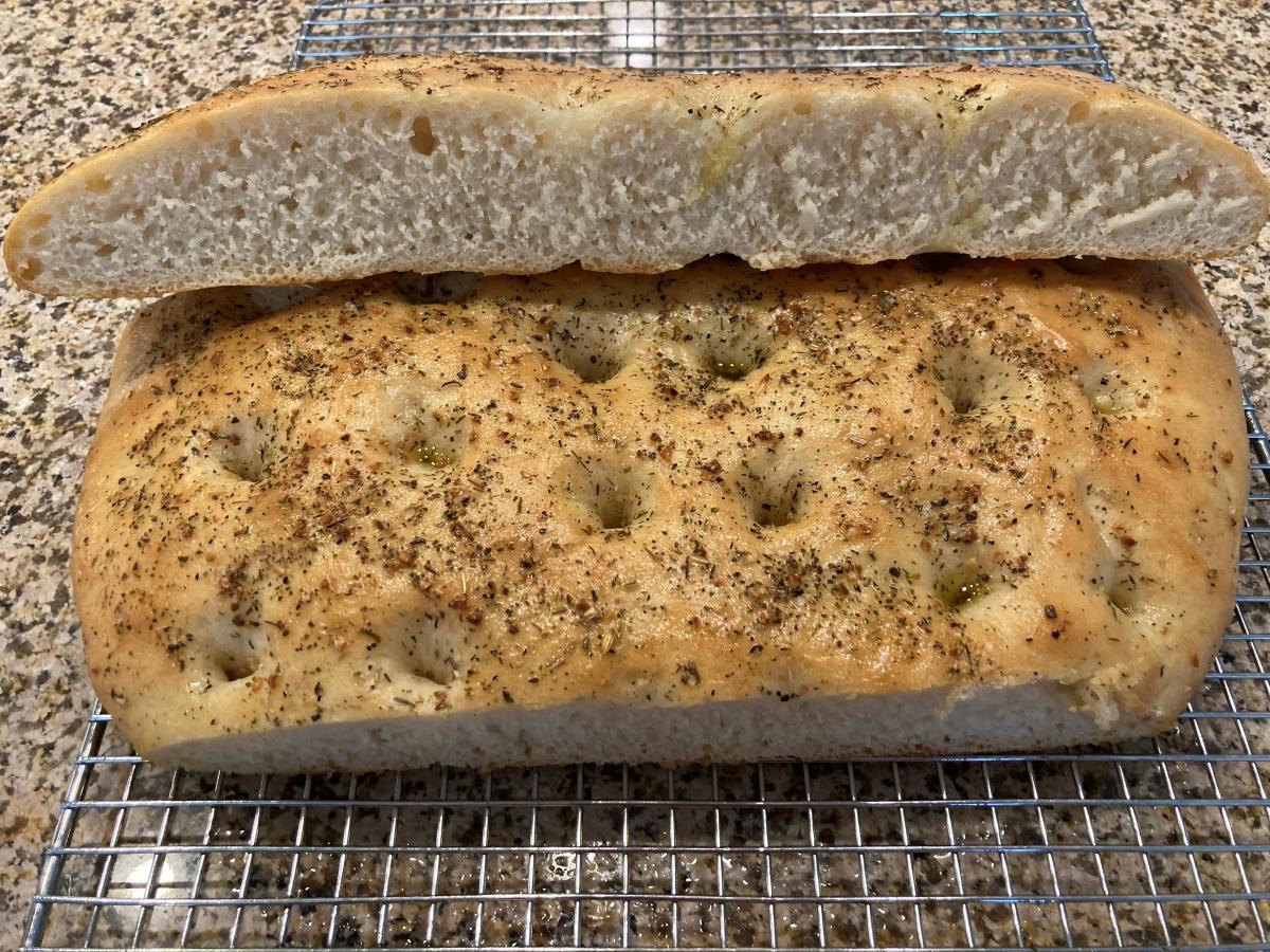 My very first try at making my own Focaccia.
I think I didn't have enough water, the crumb on this is pretty tight, but taste none the less.