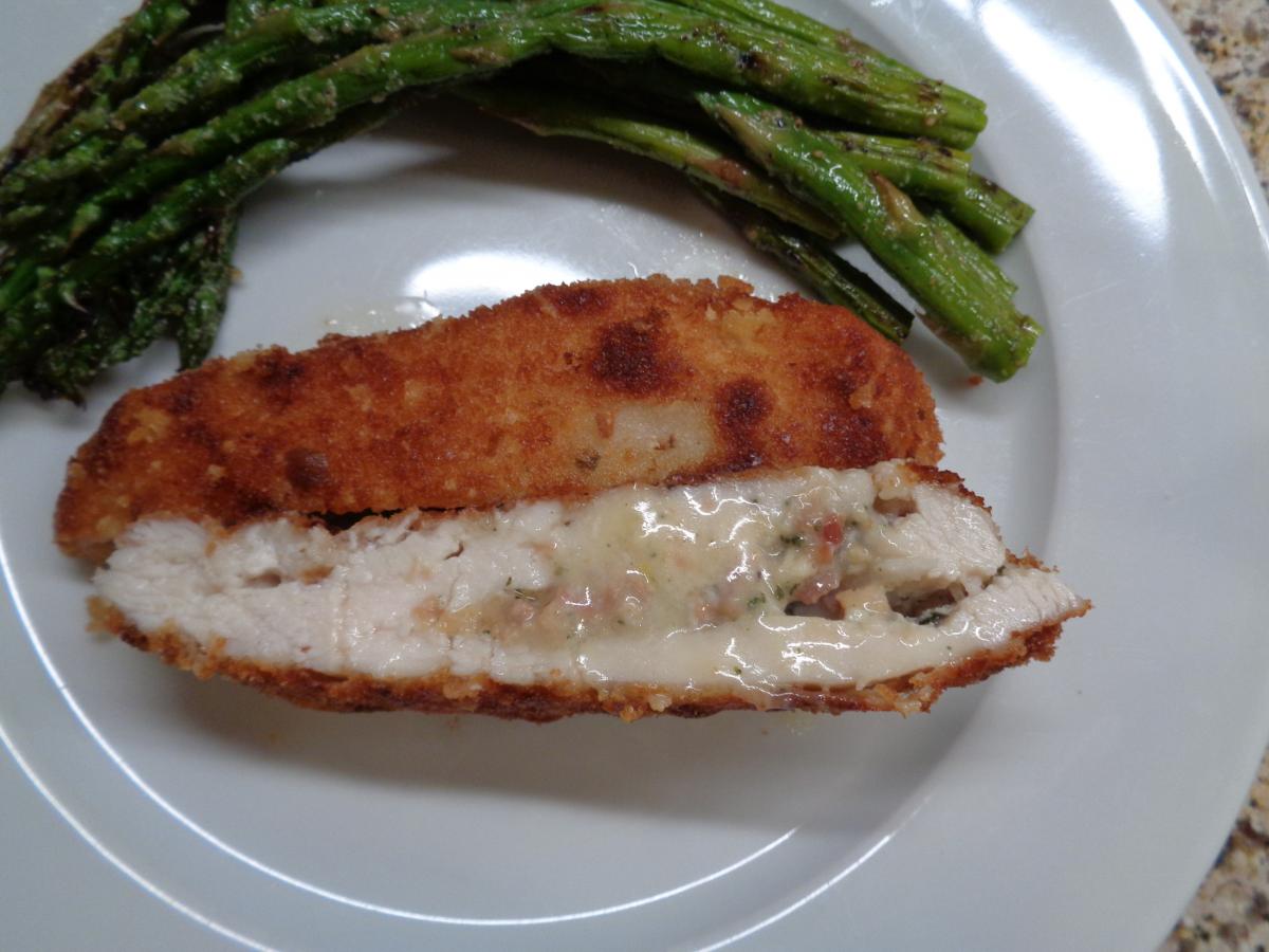 Provolone & Pancetta Stuffed Chicken Breasts with grilled fresh Asparagus, can you see the stuffing? YUM!
Try it : https://www.williams-sonoma.com/rec