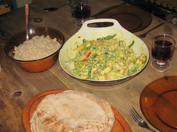 Vegetable curry with chicken, served with brown basmati rice and wholewheat pita.